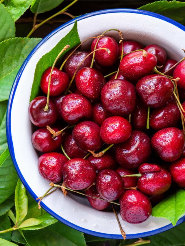 Ripe red cherry in a white bowl