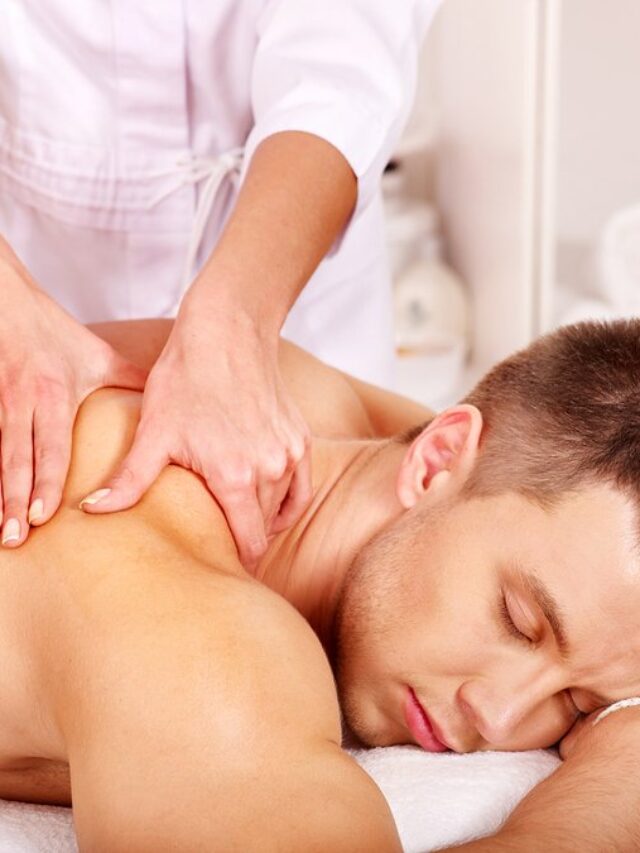 Man getting relaxing massage in spa.