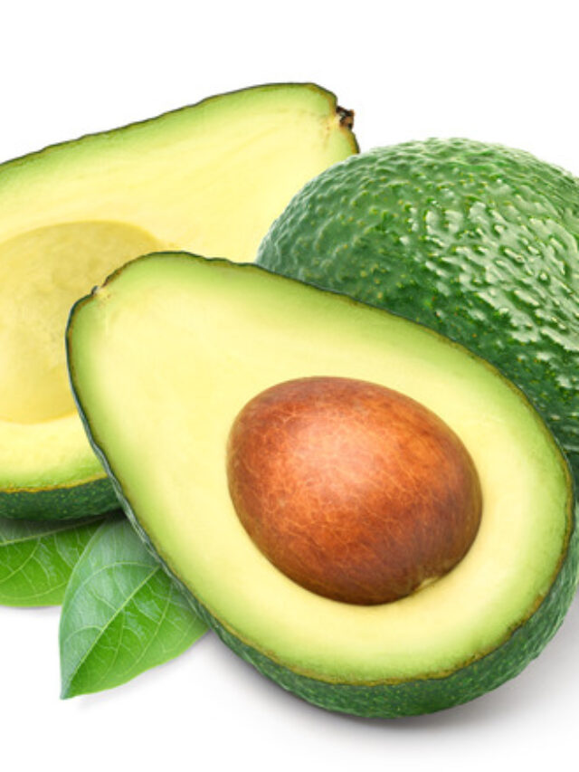 Avocado,With,Cut,In,Half,And,Green,Leaves,Isolated,On